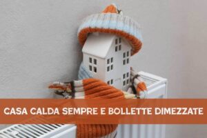 casa in miniatura sul termosifone e sciarpa intorno, scritta in basso